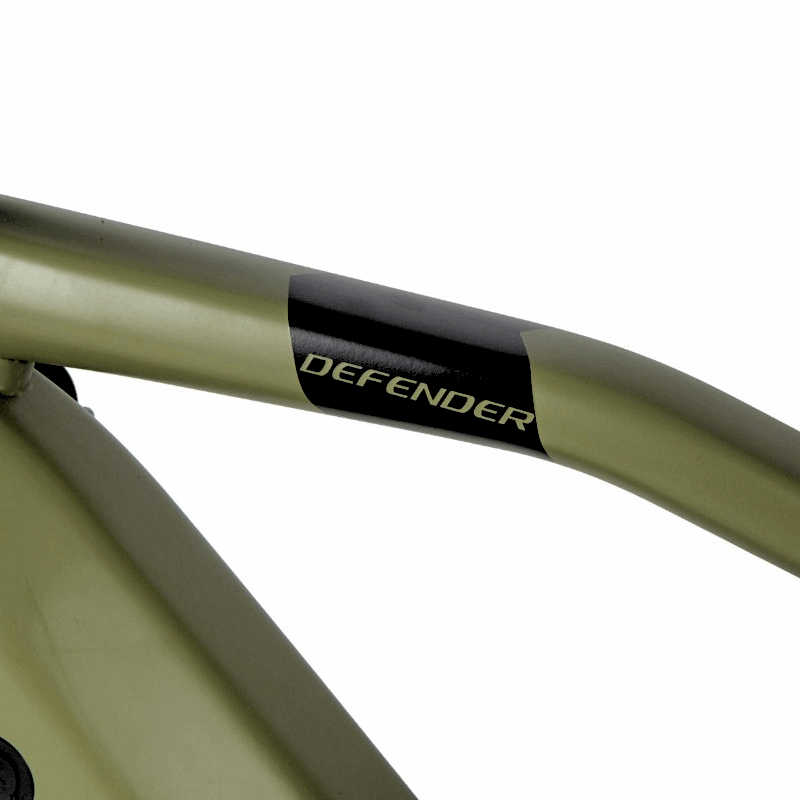 Close-up of the top tube of an e-bike frame featuring the 'Defender' branding, showcasing the sleek design of the bike's frame.