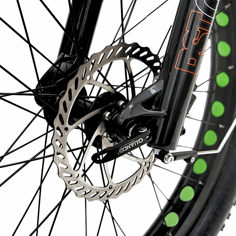 Close-up of the FAT-HD eBike's front disc brake rotor and wheel, designed for optimal stopping power and control.