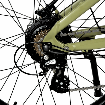 Close-up of the Shimano Altus 7-speed cassette and derailleur on an e-bike, designed to provide smooth shifting and adaptability for various terrains, allowing riders to conquer hills and increase speed with ease.