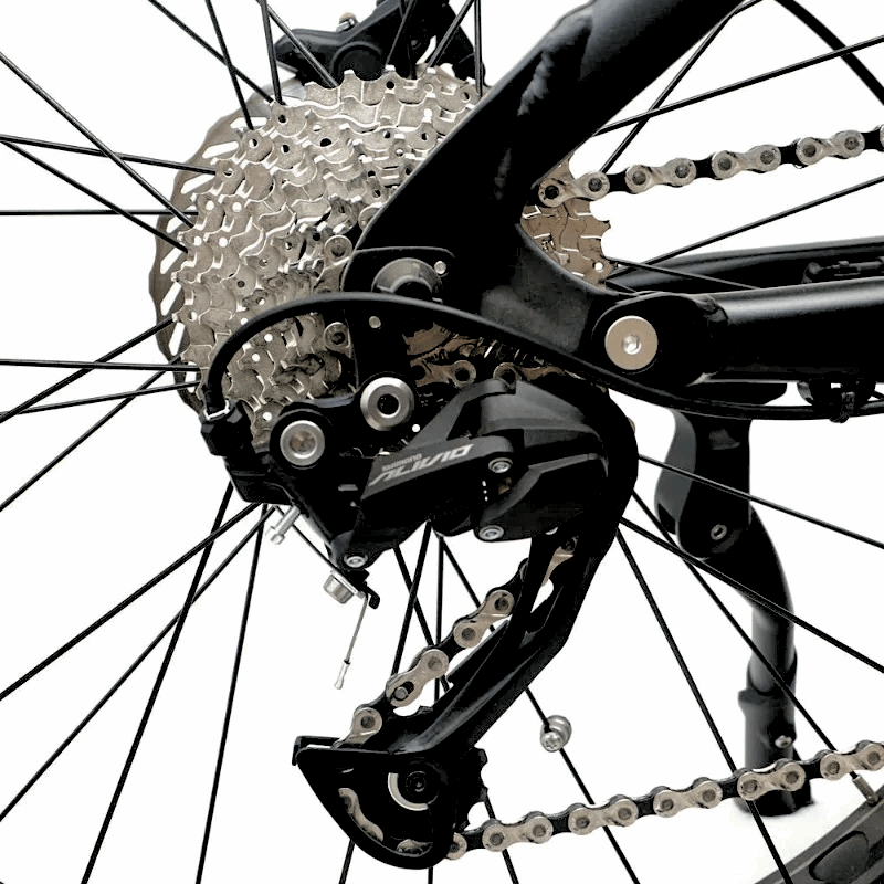 Close-up of the FAT-HS eBikeâ€™s rear drivetrain system showing the cassette, derailleur, and chain connected to the rear wheel.