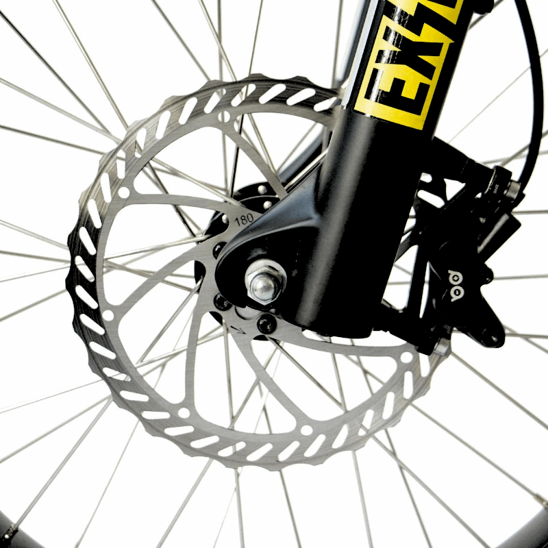 Close-up of an e-bike's front disc brake system, highlighting the 180mm rotor for powerful and reliable stopping performance.