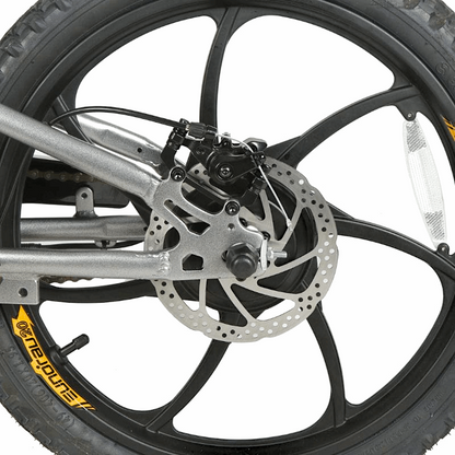 Close-up of an e-bike's integrated wheel design with disc brakes, enhancing structural integrity and streamlining the production process for improved durability.