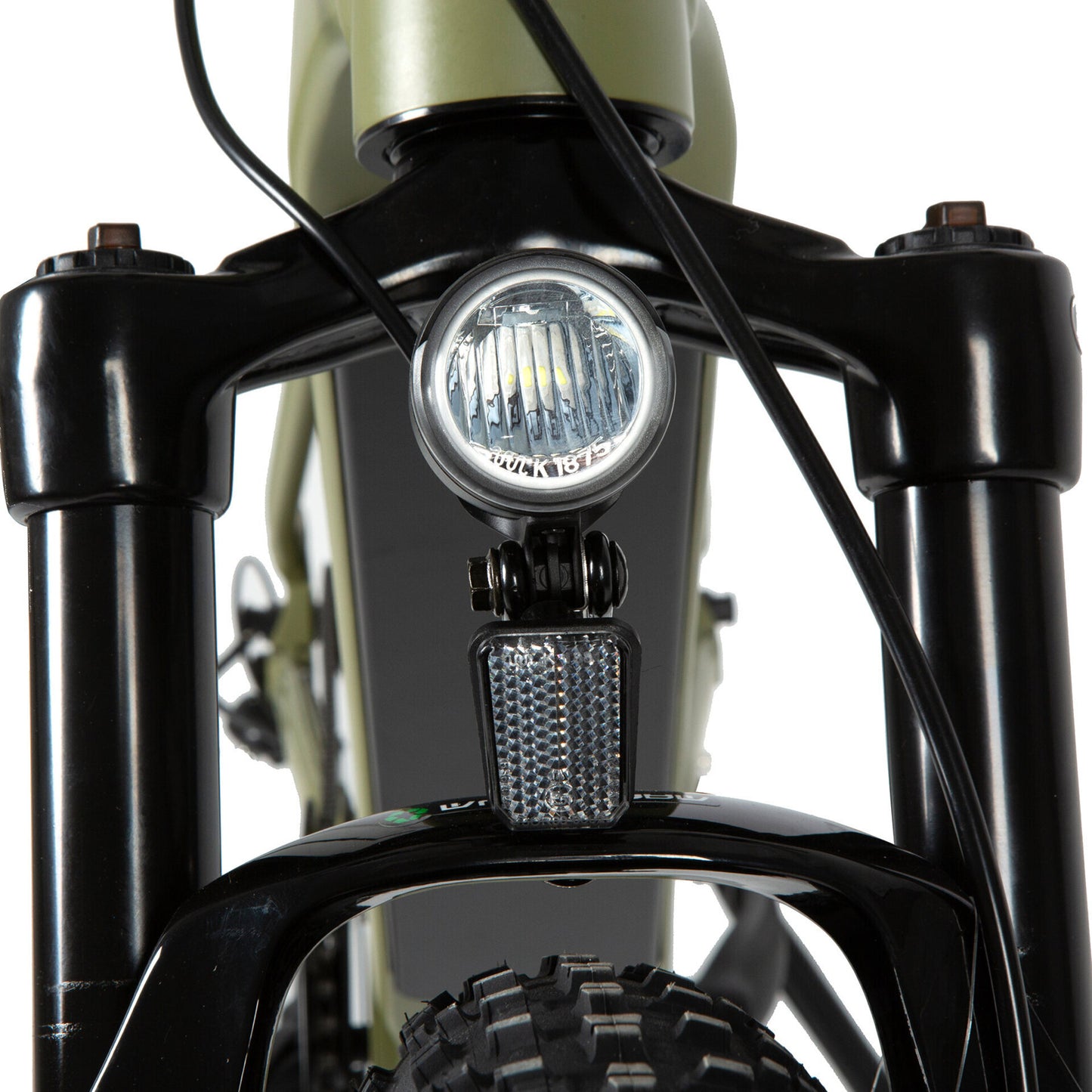 Close-up of an LED headlight mounted on the front suspension of an e-bike, powered by the main battery pack and controlled through the display, ensuring visibility and safety during night rides.