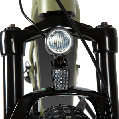 Close-up of an LED headlight mounted on the front suspension of an e-bike, powered by the main battery pack and controlled through the display, ensuring visibility and safety during night rides.