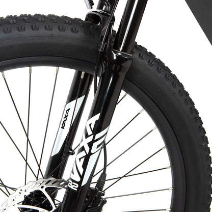 Close-up of the Zoom Vaxa 100mm suspension fork on an e-bike, designed to absorb shocks and bumps, improving comfort and handling on rough terrain.