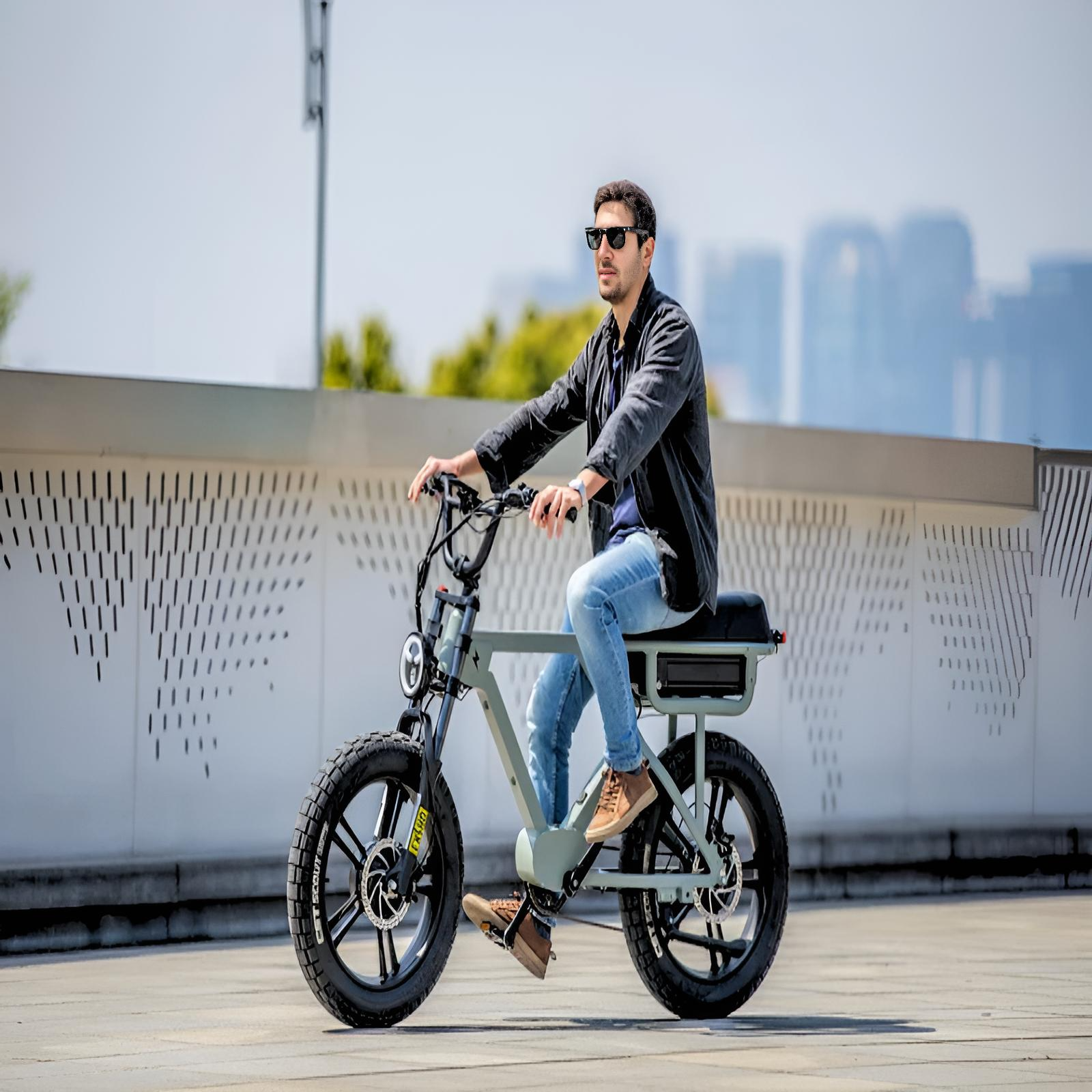 A rider on a FLASH e-bike in an urban setting, showcasing the bike’s design and features.