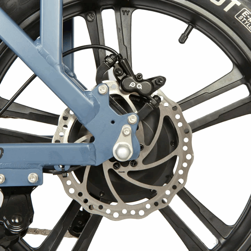 Close-up of an e-bike's rear disc brake system, highlighting the caliper and rotor for efficient braking performance.