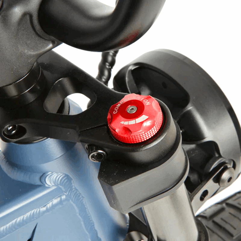 Close-up of an e-bike's suspension fork compression adjuster, providing customizable ride comfort with easy access to adjustment.