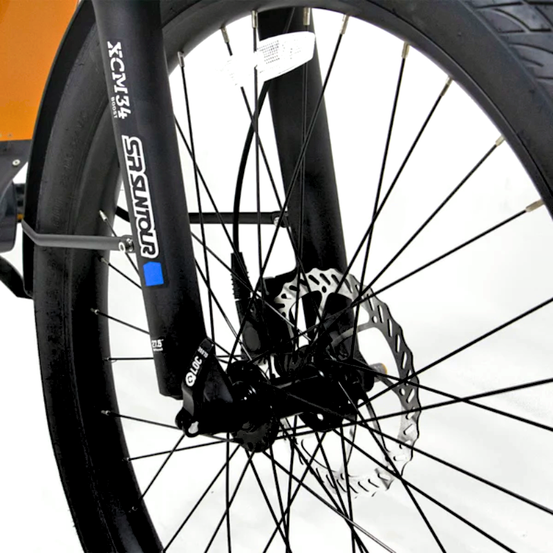 Close-up of the META275 eBike front suspension fork with disc brake system.