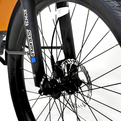 Close-up of the META275 eBike front suspension fork with disc brake system.