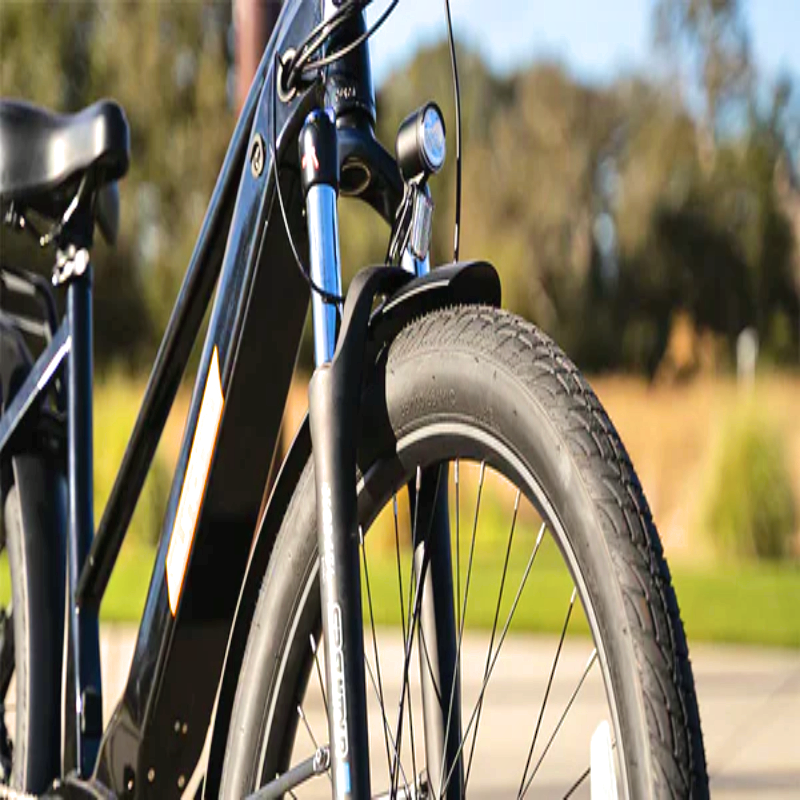 Front view of the META275 eBike showing the front suspension and LED headlight.