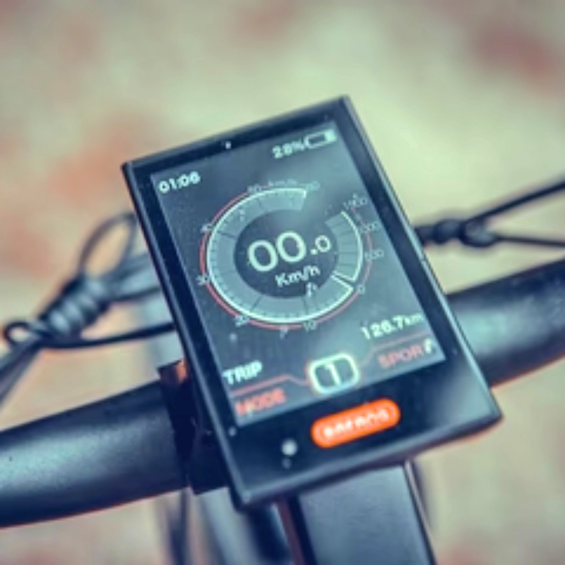 Close-up of the BAFANG display on the SPECTER-ST eBike showing speed, trip distance, and mode.