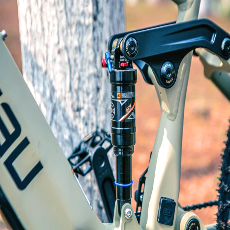 Close-up of the rear suspension on the SPECTER-S eBike, showing the shock absorber.