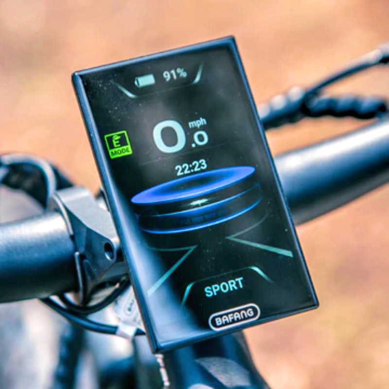 Close-up of the BAFANG display on the SPECTER-S eBike showing speed, battery level, and mode.