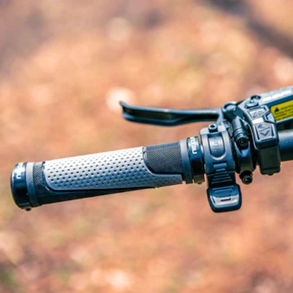 Handlebar of the SPECTER-S eBike showing the grip, brake lever, and throttle control.