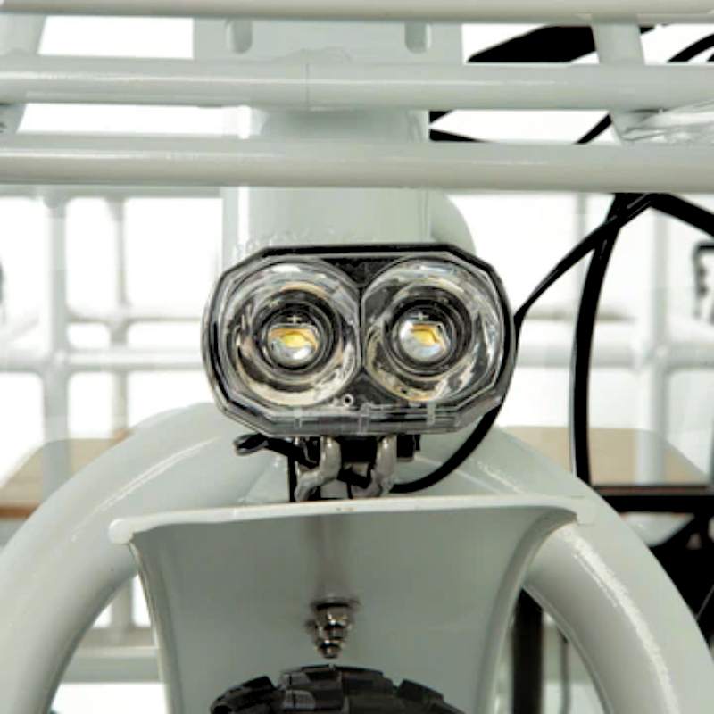 Front LED headlight of the eTRIKE for better visibility during night rides.