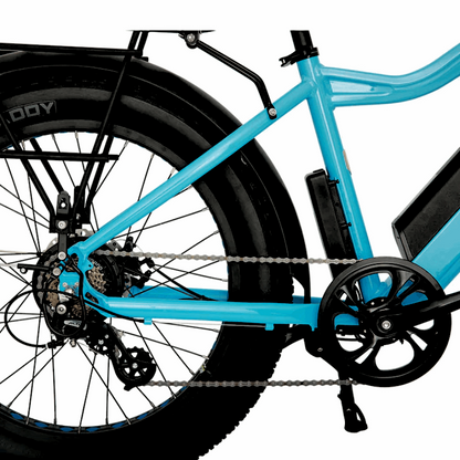 Side view of the rear drivetrain and fat tire on the blue FAT-AWD Winter E-Bike, showing the chain and fat tire setup.