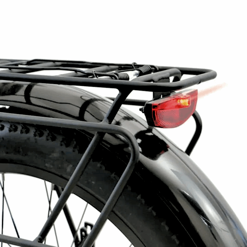 Rear cargo rack view of the FAT-AWD Winter E-Bike with a rear light, highlighting the rack and light for night visibility.