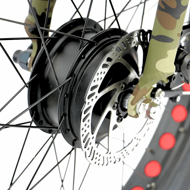 Close-up of the front hub motor and disc brake on the camo FAT-AWD Winter E-Bike, showing the black motor and disc details.