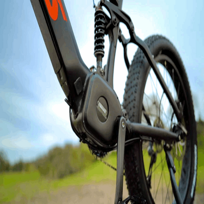 Side view of the FAT-HS eBike's Bafang mid-drive motor and rear suspension, highlighting the motor's power and suspension's performance.