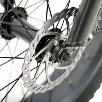 Close-up of the hydraulic disc brake rotor on the FAT-MN Folding eBike, providing enhanced stopping power and safety.