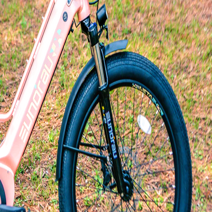 Close-up of the front wheel and suspension fork on the pink EUNORAU eBike.