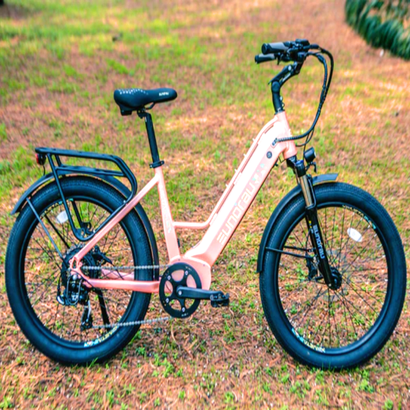 Side view of the pink EUNORAU META eBike displayed in an outdoor setting.